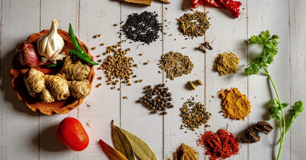 Assorted Spices and Herbs on a table | Health Benefits of Spices and Herbs