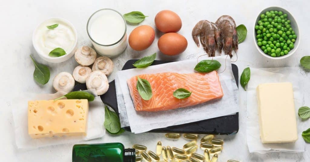 A display of Vitamin D dietary sources like yogurt, mushrooms, eggs, shrimp, peas, cheese, salmon, etc., Health Benefits of Sun Exposure