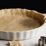 A fresh gluten-free pie shell resting in a pie pan