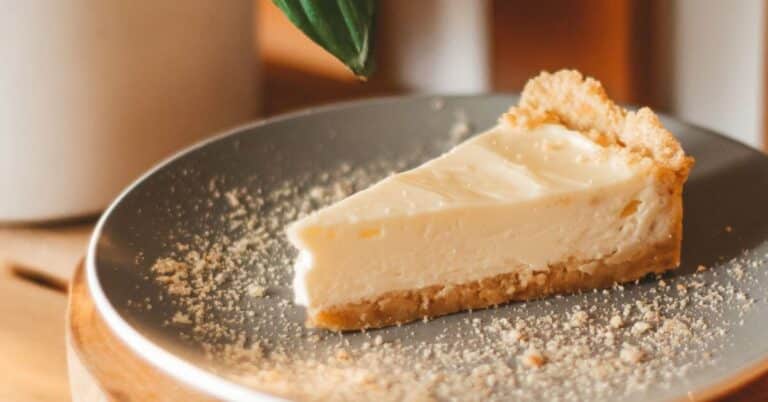 A slice of cheese cake with a graham cracker crumb crust, Gluten Free Holiday Dessert Recipes
