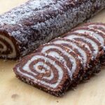 A sliced swiss roll rests on a cutting board, Gluten Free Holiday Dessert Recipes