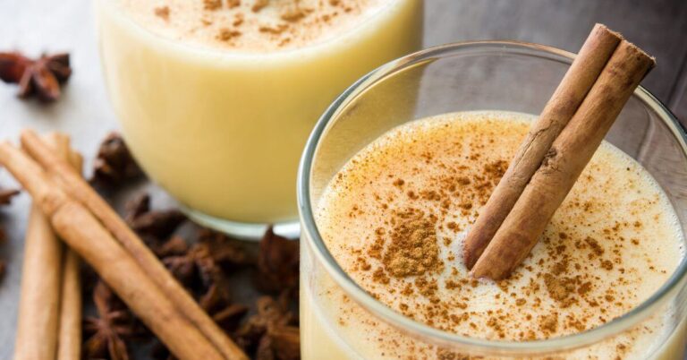 Fresh eggnog topped with a sprinkle of cinnamon and a cinnamon stick, Gluten Free Holiday Dessert Recipes