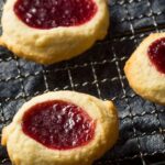 Golden-brown thumbprint cookies, filled with a strawberry jam, Gluten Free Christmas Cookie Recipes