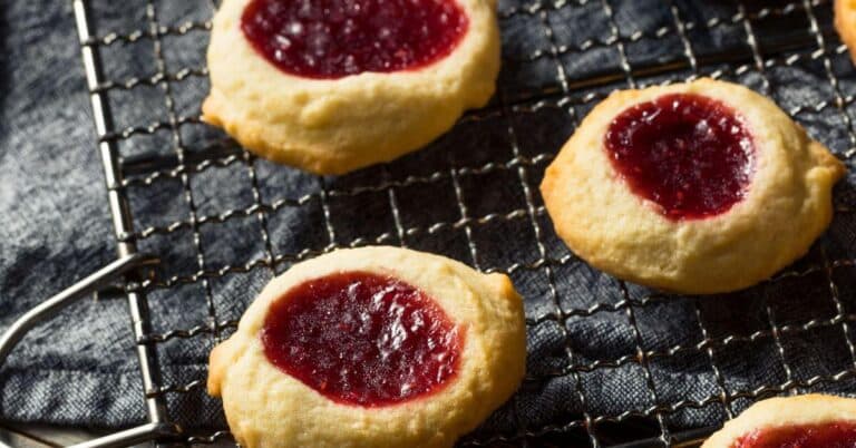 Golden-brown thumbprint cookies, filled with a strawberry jam, Gluten Free Christmas Cookie Recipes