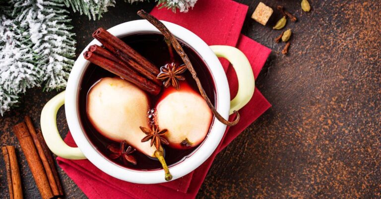 Two skinned pears rest in a hot pot with fresh spices, Gluten Free Holiday Dessert Recipes