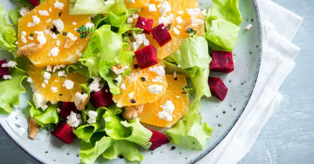 Salad with leafy greens, oranges and beets