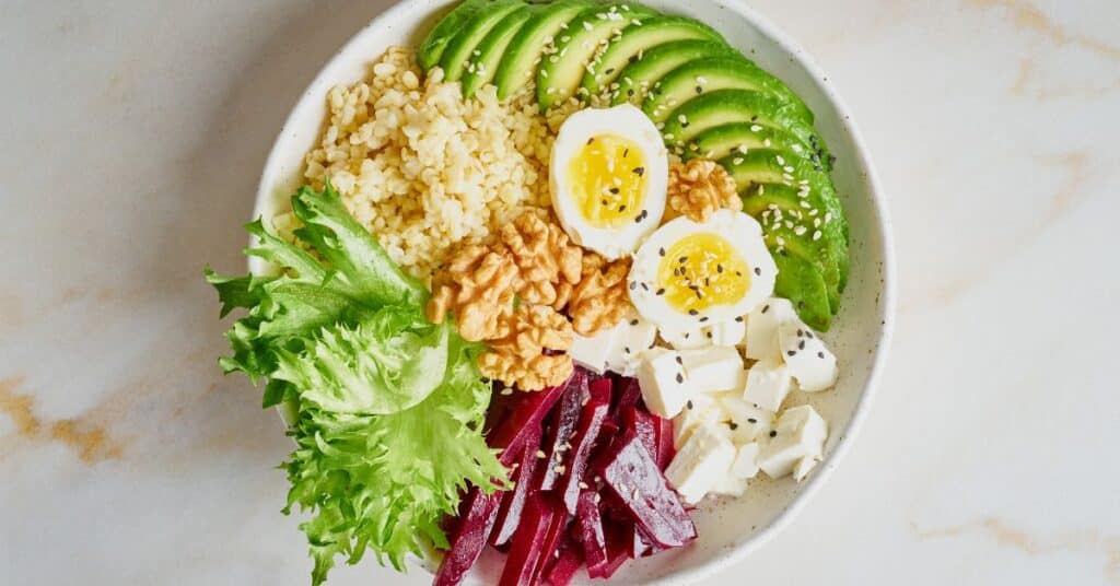 Balanced meal with grains, lettuce, beets, eggs, avocado and walnuts, Side Effects of Dieting